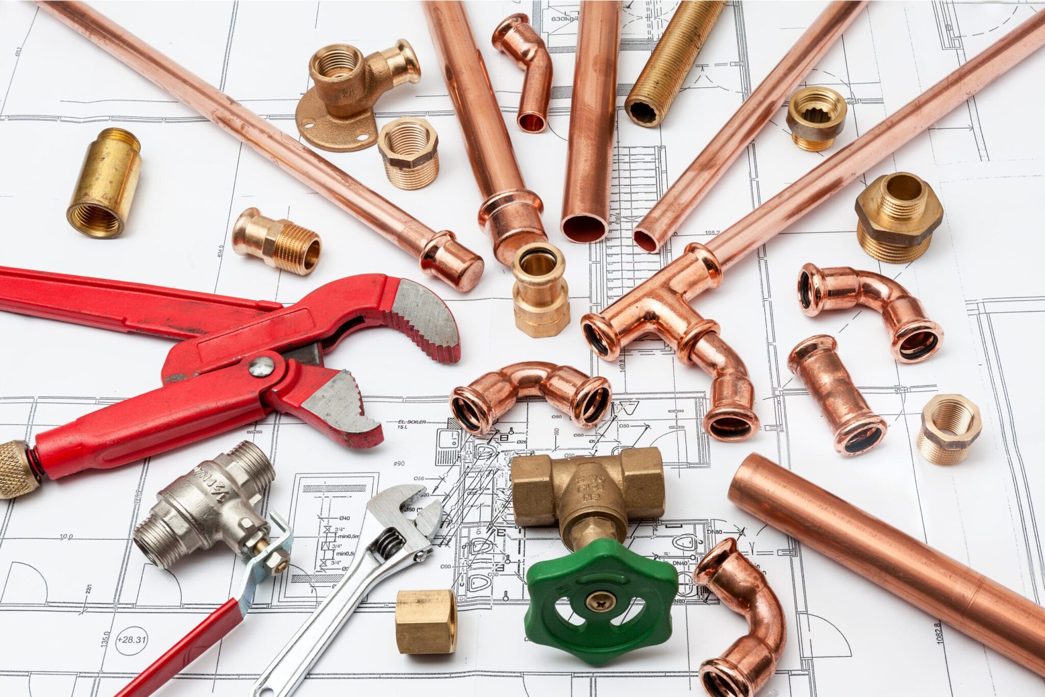 Copper pipes, fittings, valves, and plumbing tools in Golden